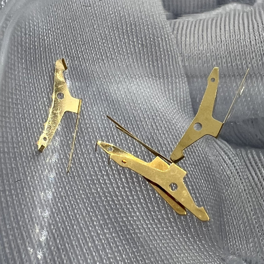 Golden spring jumper for ETA C01.211 watch part, precision fit for seamless movement function.