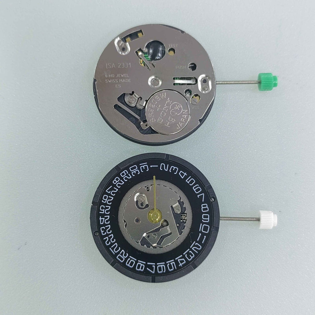 Black dial watchmaker repair part with ISA 2331 quartz movement and date at 3 position.