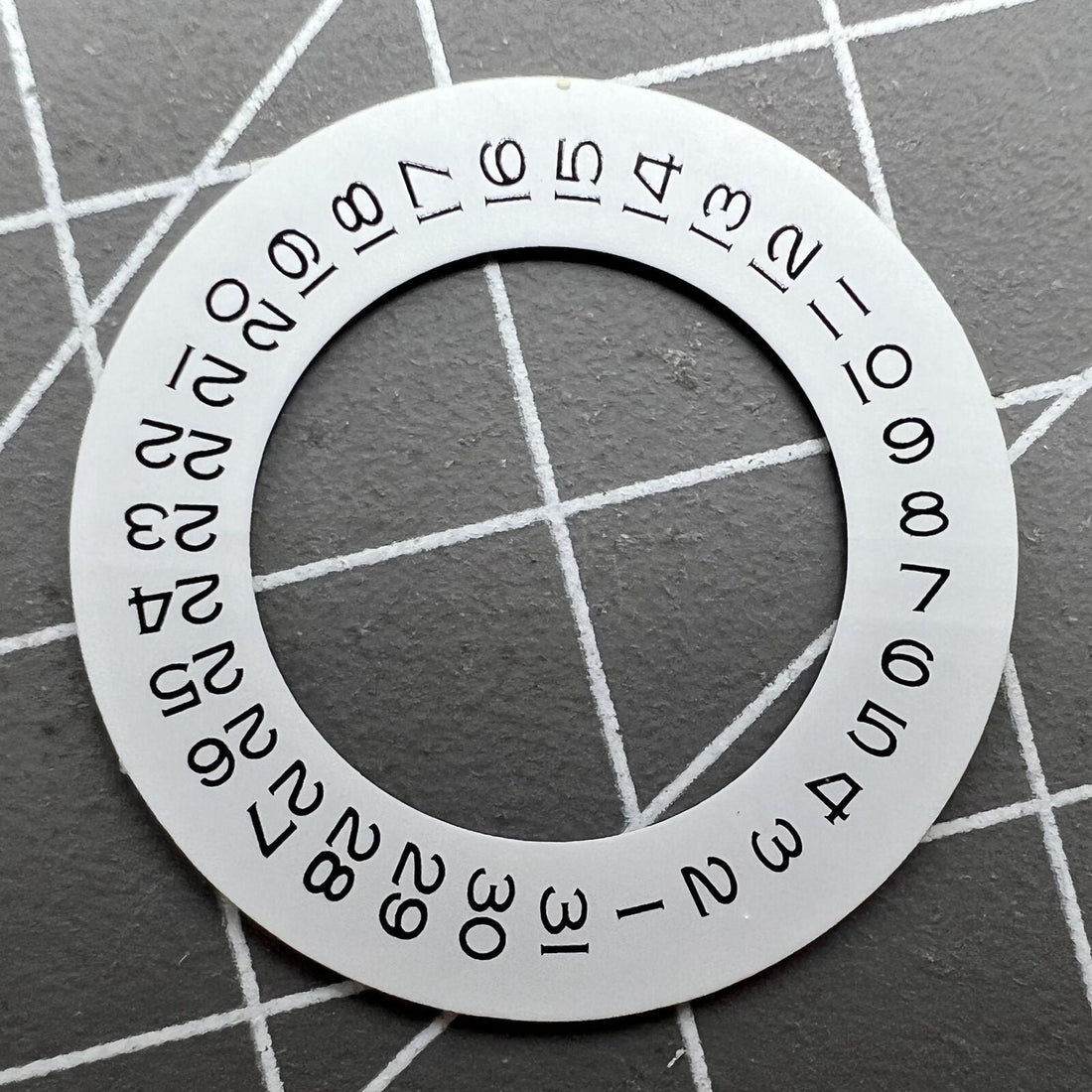 Thickening white date wheel overlay for ETA2824 movement with date window at 3 o'clock.