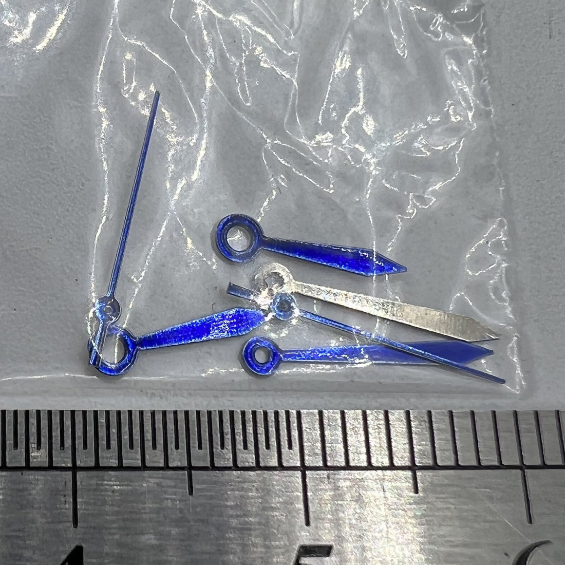 11mm blue arrow-shaped watch hands by Miyota for 2035 quartz movement, no lume, sleek design.