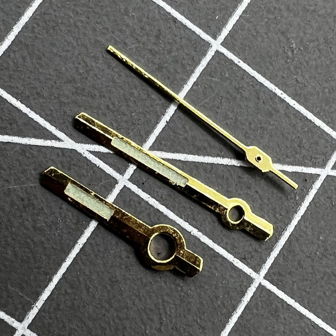 11mm golden trim green luminous watch hands designed for Orient 46941 and 46943 movements, enhancing visibility.