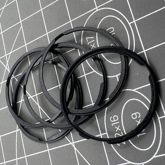 Black cushion mount spacer ring by Orient for 46943 movement, securing watch dials precisely.