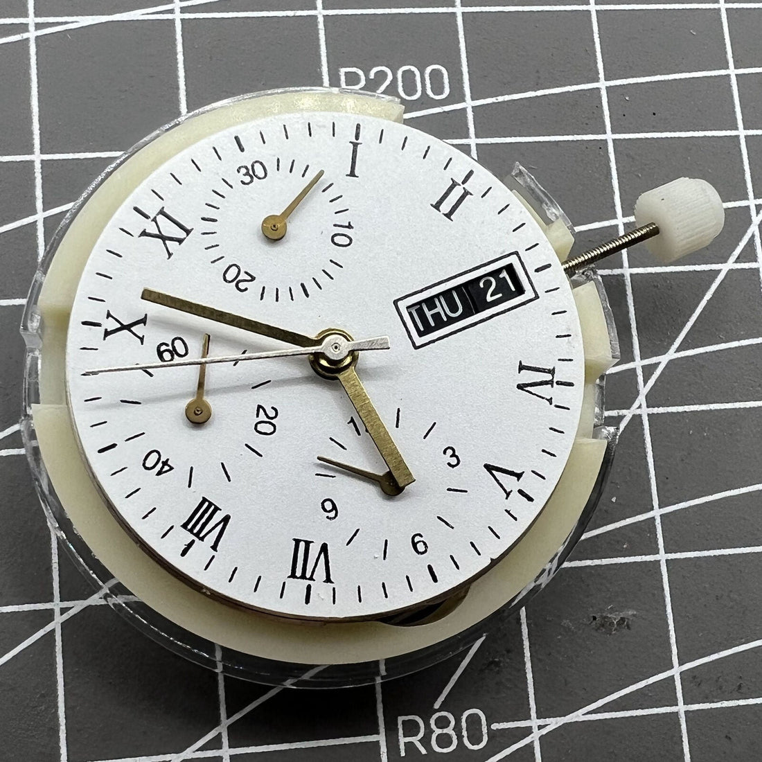 SHANGHAI 7750 black dial watch with day, date, and small seconds at 9 o'clock, automatic movement.