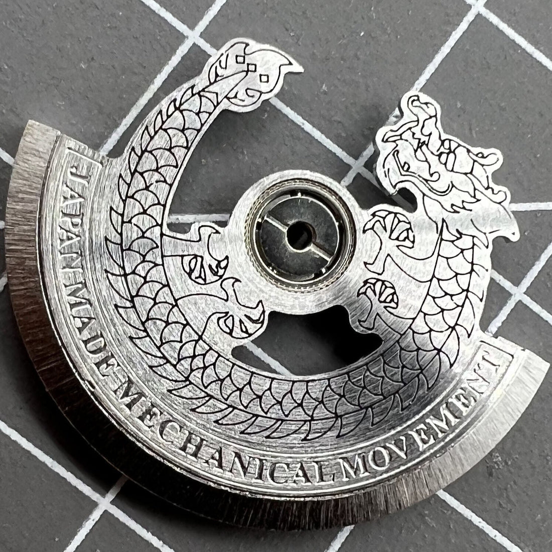 Silver Dragon carved rotor oscillating weight for NH35 NH36 watch movement, detailed craftsmanship.