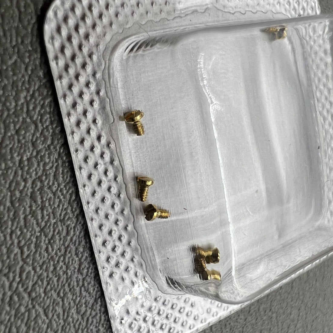 Set of gold-tone screw back covers for La Grande Classique de watch cases, elegant replacements by [Brand Name]