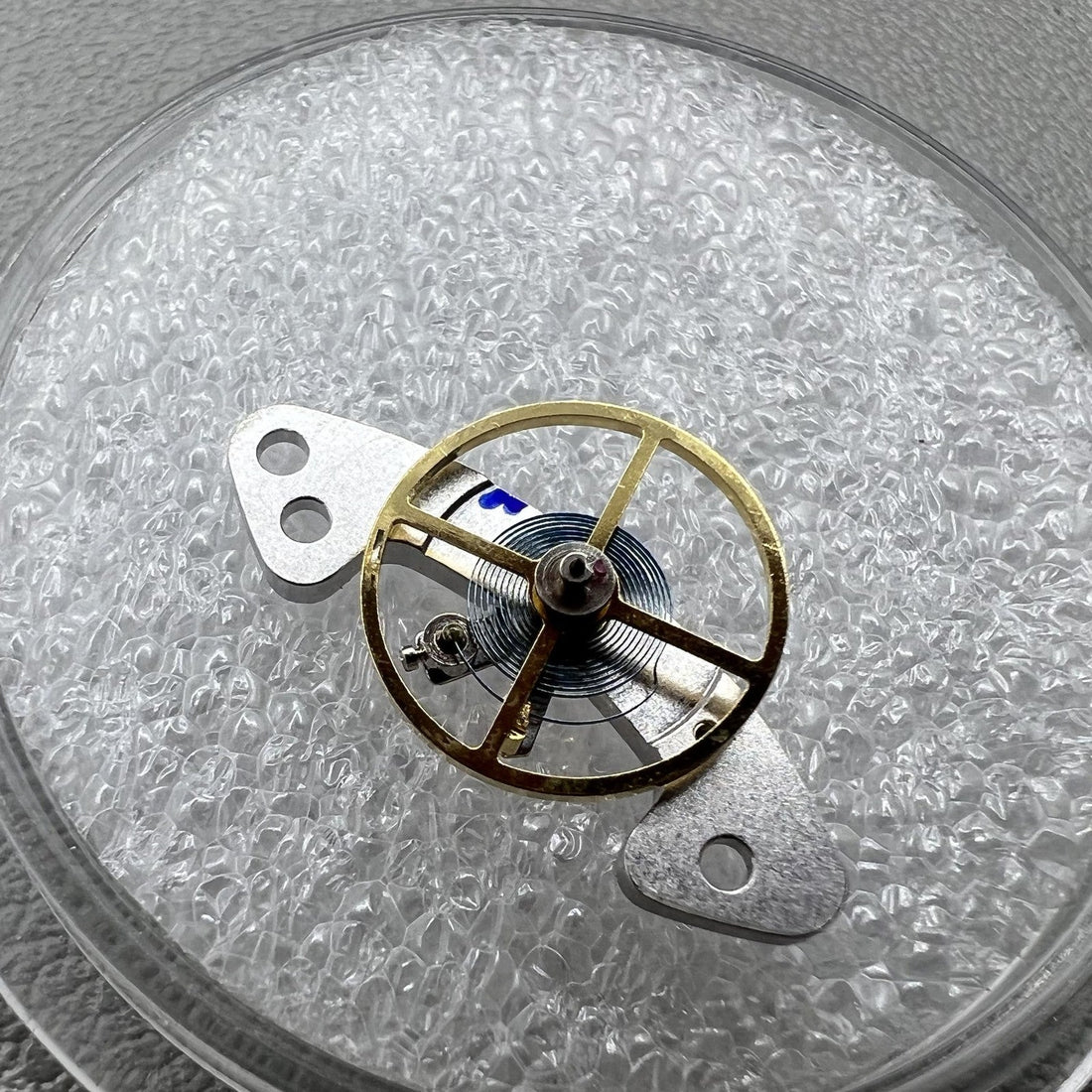 Complete blue balance spring weight for Dandong 4130 watch movement, enhancing precision and durability.