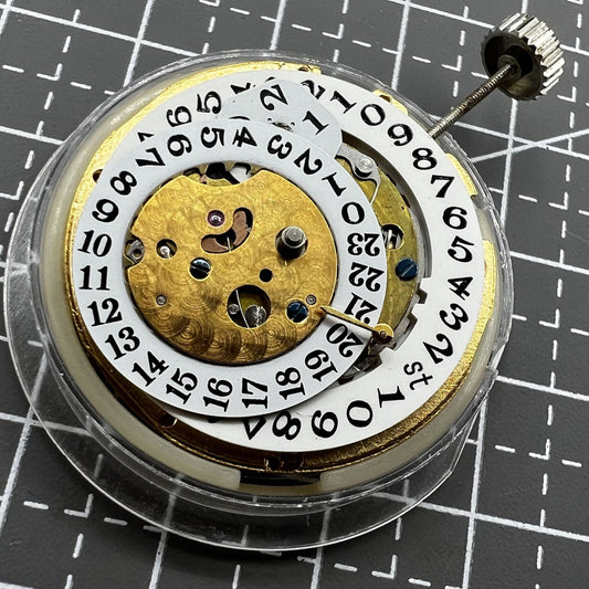Multifunctional automatic watch with mechanical movement, date at 2 o'clock, and 24-hour digital dial.