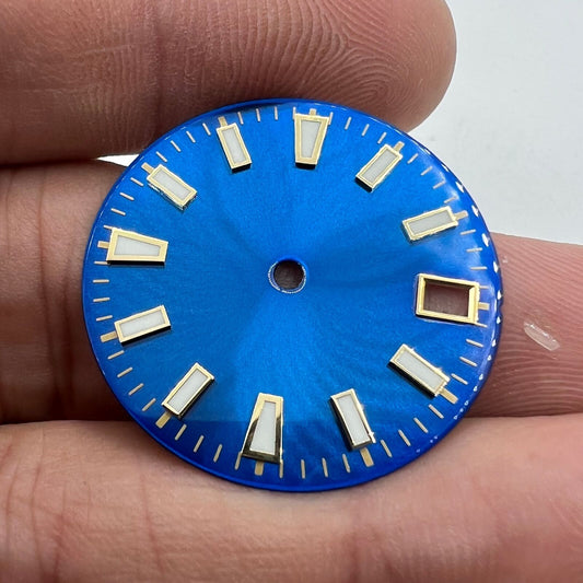 Green luminous blue and gold watch dial for NH35 movement with nail trim detail.