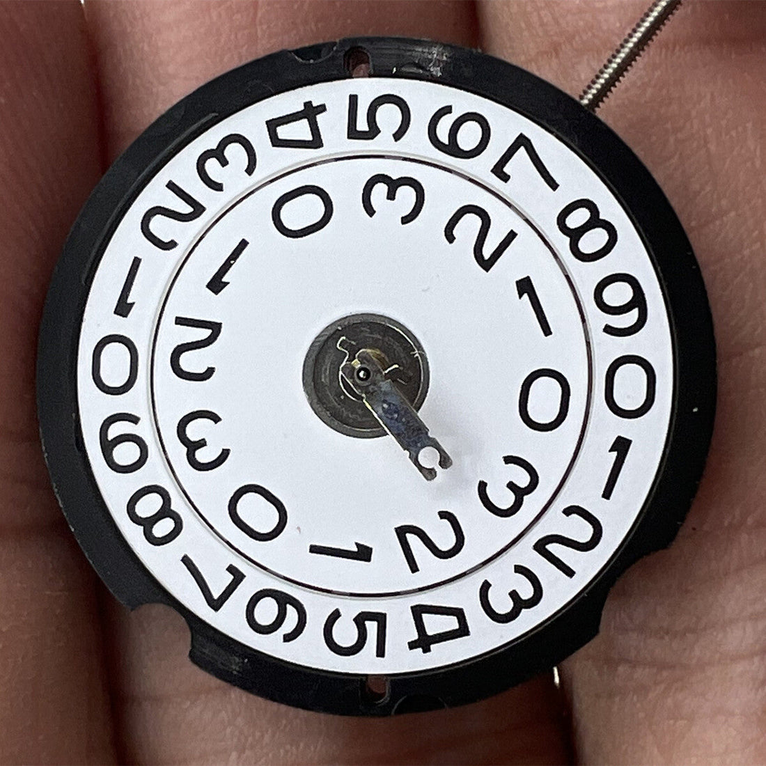 Ronda 509 quartz watch movement with Swiss parts, precise and reliable timekeeping mechanism.