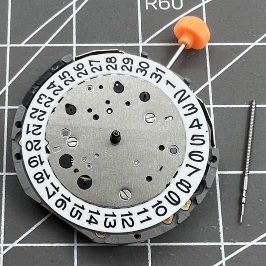 Miyota JS26 quartz watch movement with small seconds at 6, 9, and date display at 3, Japan made.