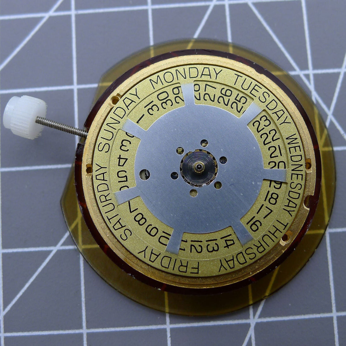 ETA 955.132 quartz watch movement showcasing double calendar with week at 12 and date at 3 position, Swiss made.