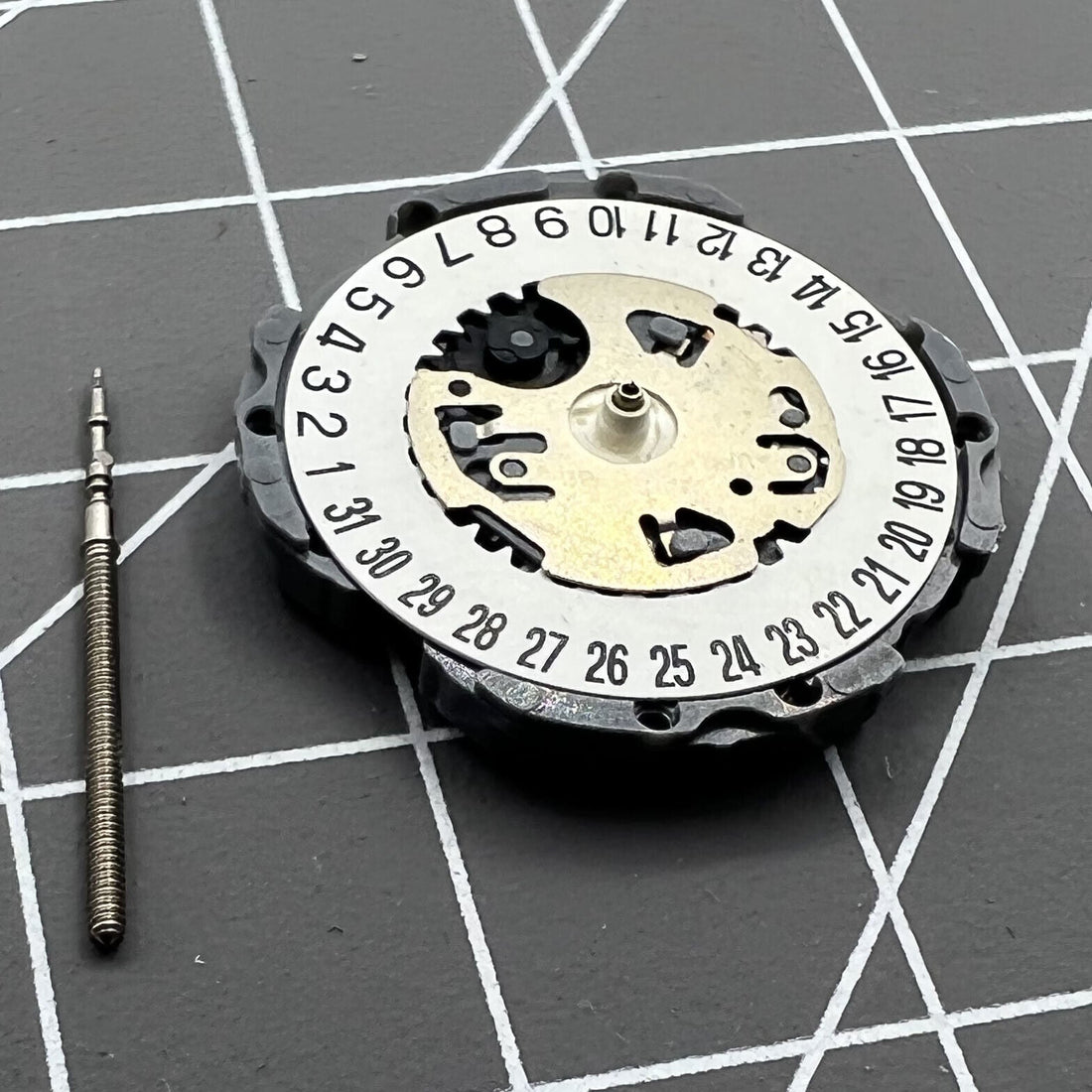 Hattori Epson VJ12B quartz watch movement with date at 6, precision Japan-made mechanism