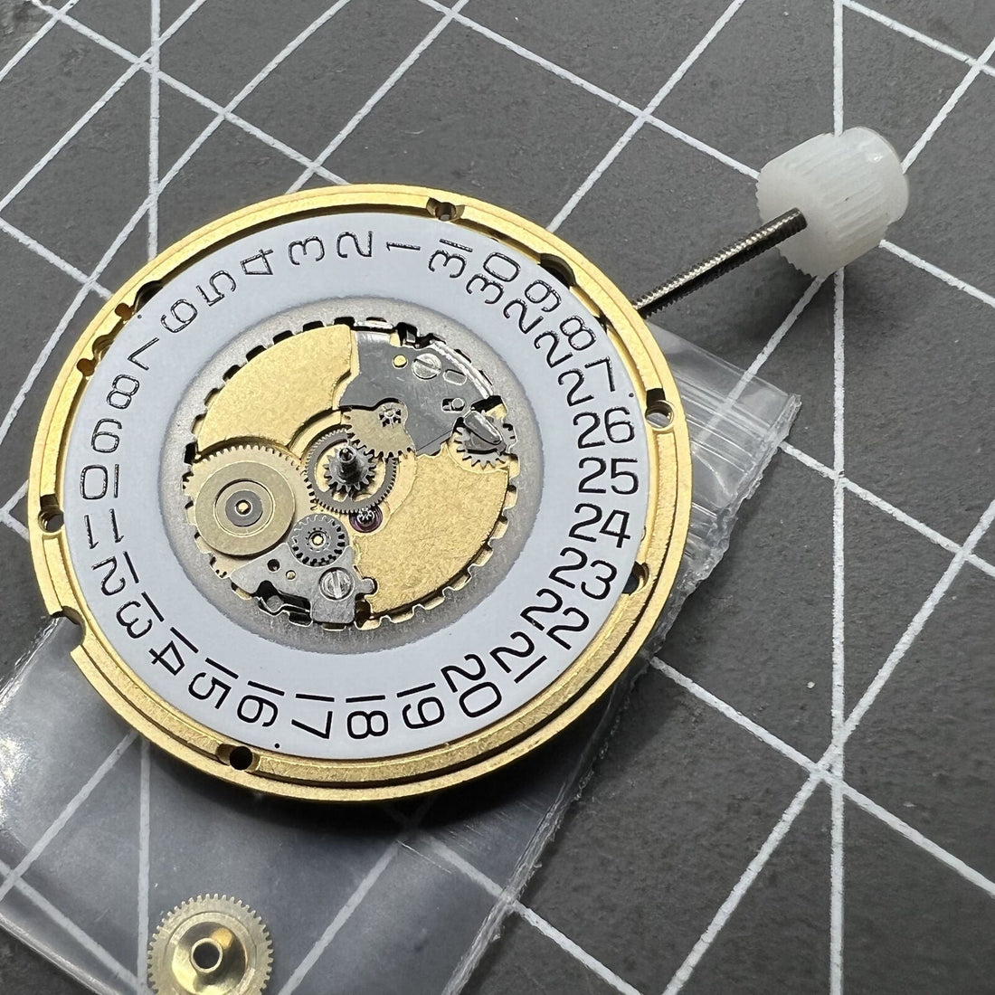 ETA 955.412 quartz watch movement with 3 hands and date display at 3 o'clock for precise timekeeping.