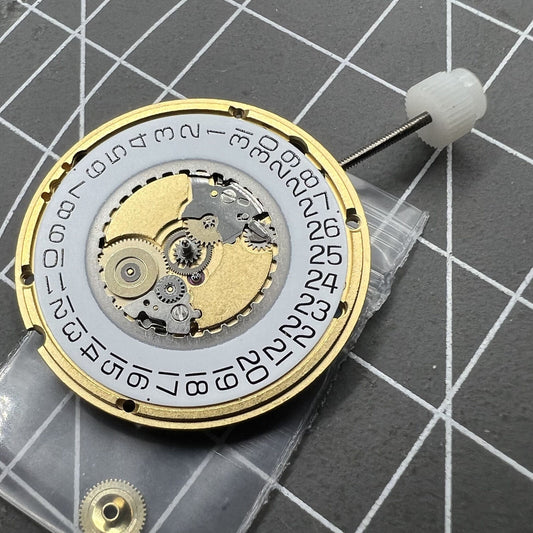 ETA 955.412 quartz watch movement with 3 hands and date display at 3 o'clock for precise timekeeping.