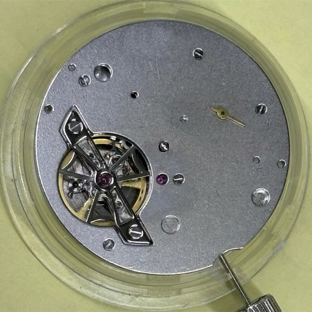 Tianjin Seagull ST25 mechanical watch movement with date at 12, precision China-made component.