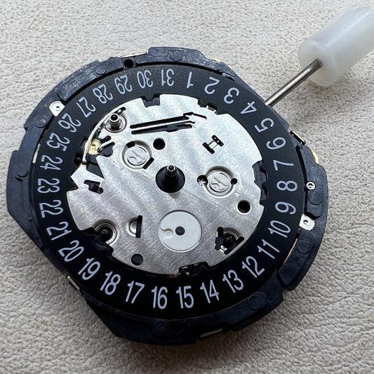 Seiko 7T82A quartz watch movement close-up, precision timekeeping by Seiko.