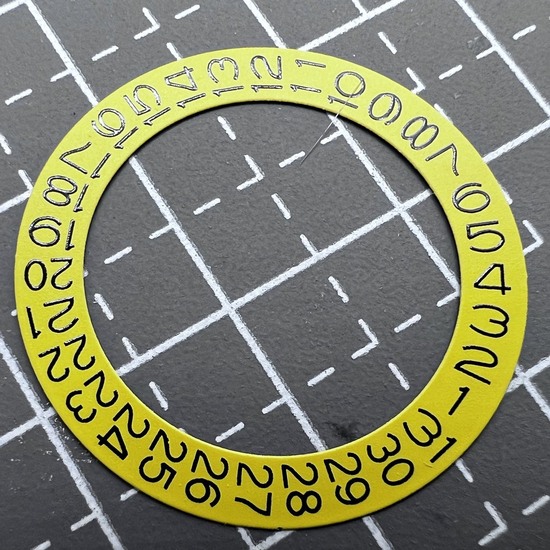 Yellow date disk wheel for Seiko NH35 NH36 watch movement with date at 3 o'clock position.