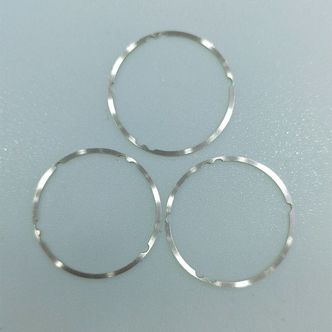 Set of 3 stainless steel dial spacer rings for NH70 NH72 watch movements, enhancing fit and stability.