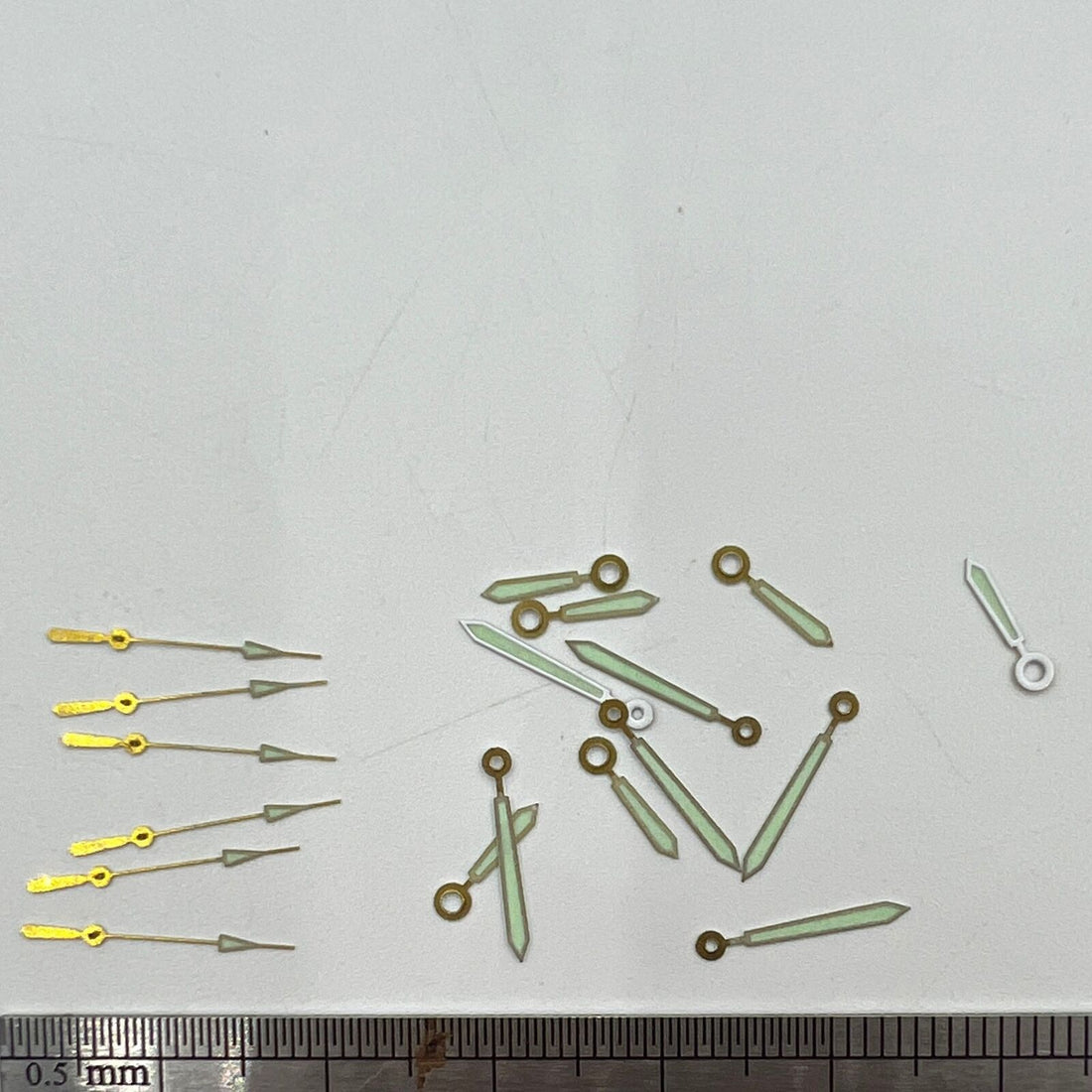 Silver-trimmed 12mm watch hands with green lume, compatible with Hattori Epson PC32 quartz movements.