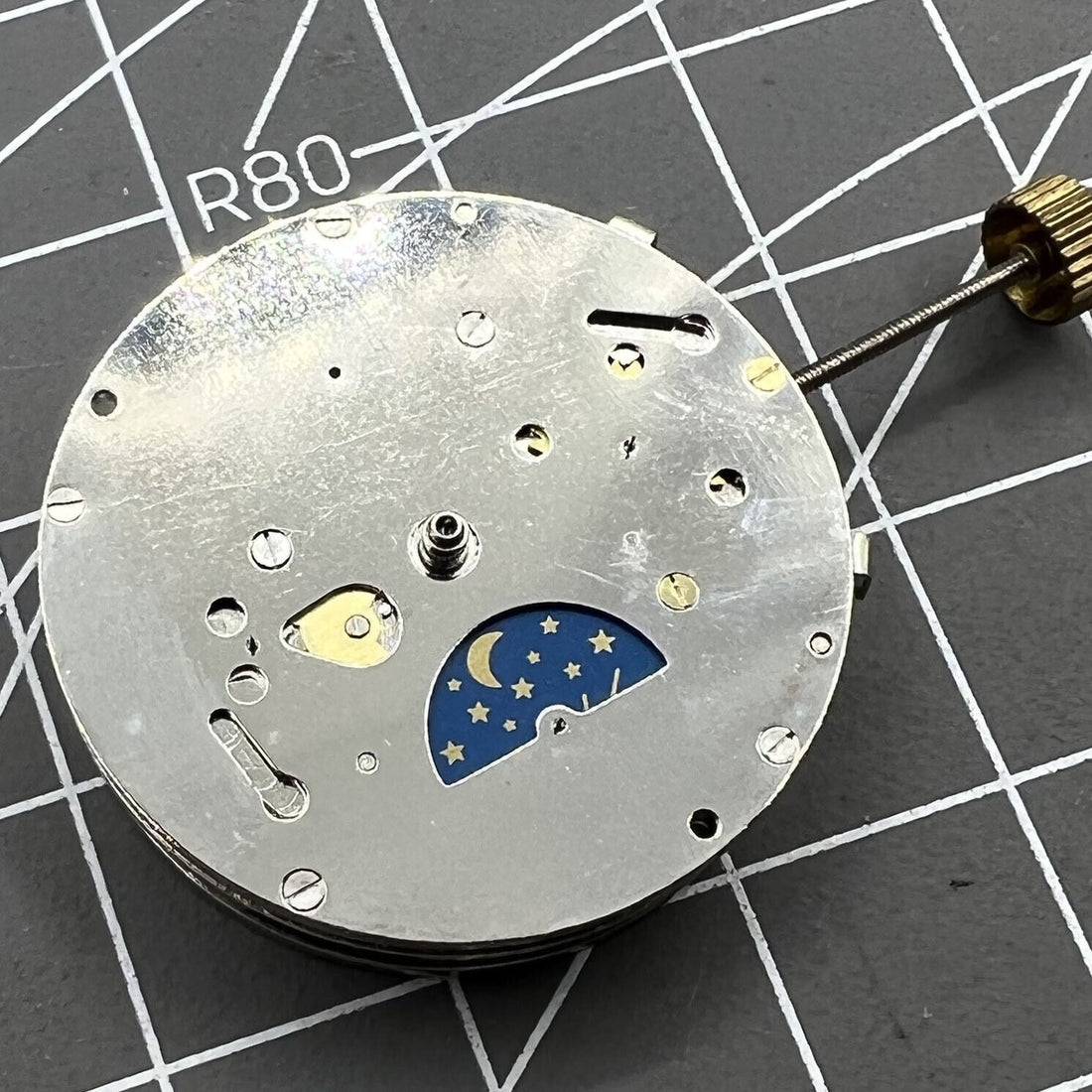 2813 8205 8215 watch showing automatic mechanical movement with moon phase at 6 o'clock, China Made.
