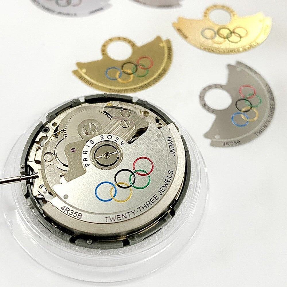 Silver metal sheet overlay featuring the Five Olympic Rings design for NH35 rotor by Hammer, enhancing watch accessories.
