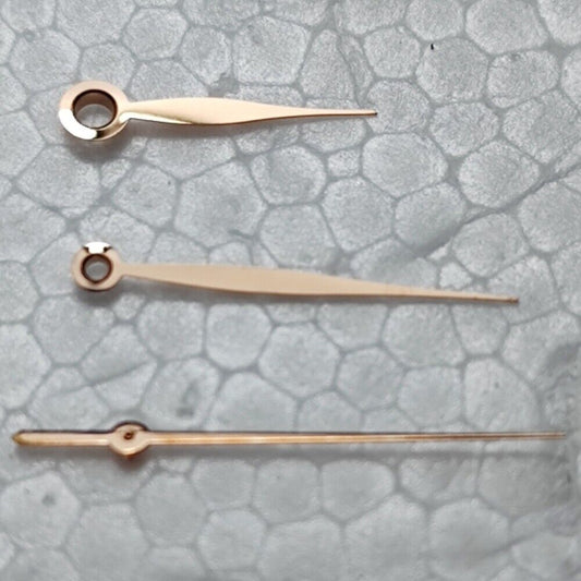 Polished rose gold leaf-shaped watch hands for LB06 movement, elegant design.