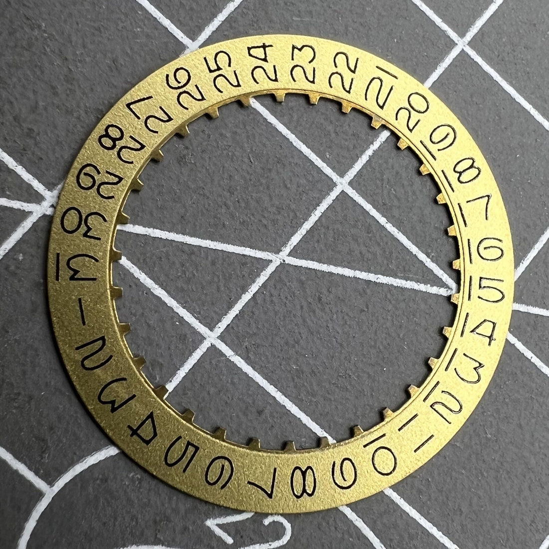 Golden numerical date disk wheel for ETA2824 Datejust watch, precise replacement part.