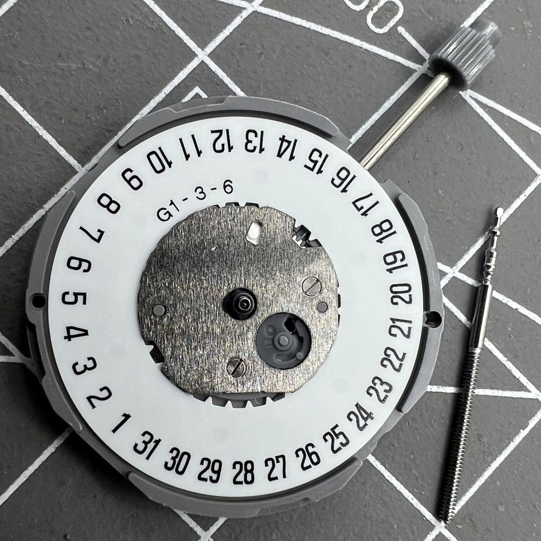 Miyota GM12 Japan quartz watch movement with date display at 6 o'clock, precision engineered.