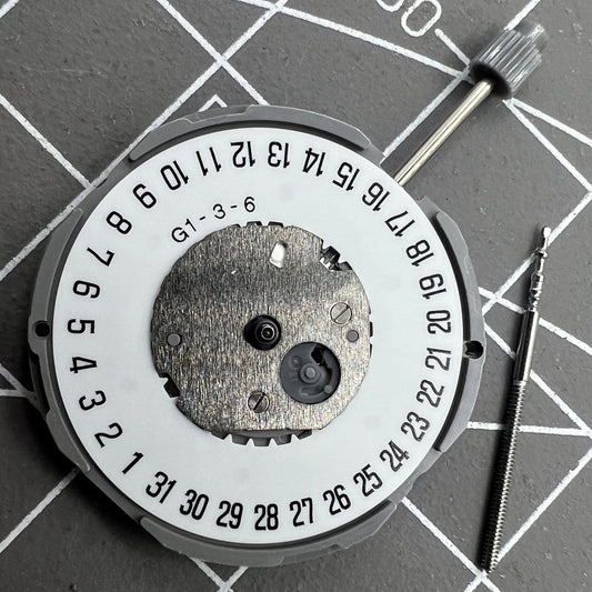 Miyota GM12 Japan quartz watch movement with date display at 6 o'clock, precision engineered.