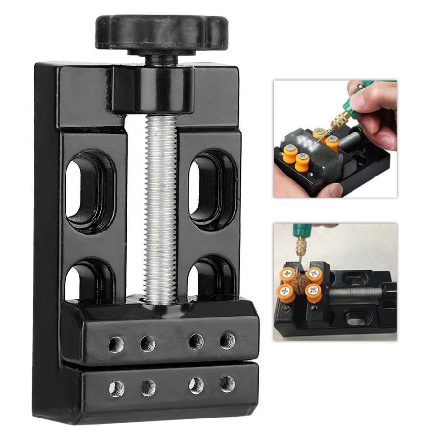 Mini electric drill with flat vice clamp for jewelry work, precise miniature tool for fine crafts.