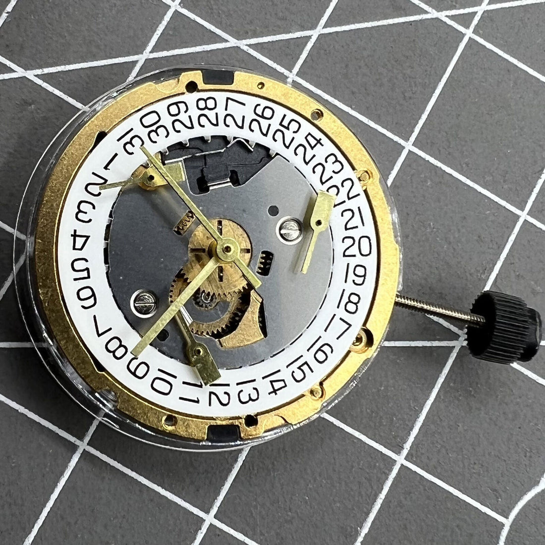ETA 251.471 multifunctional quartz movement close-up showing precise watch mechanism details.