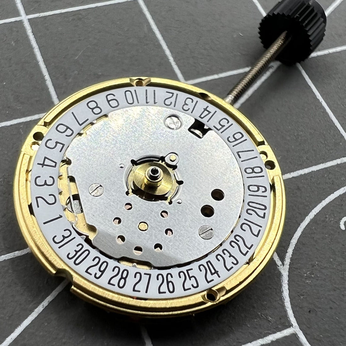 ETA F03.115 quartz watch movement with 3 hands and date display at 6 o'clock, precision craftsmanship by ETA.