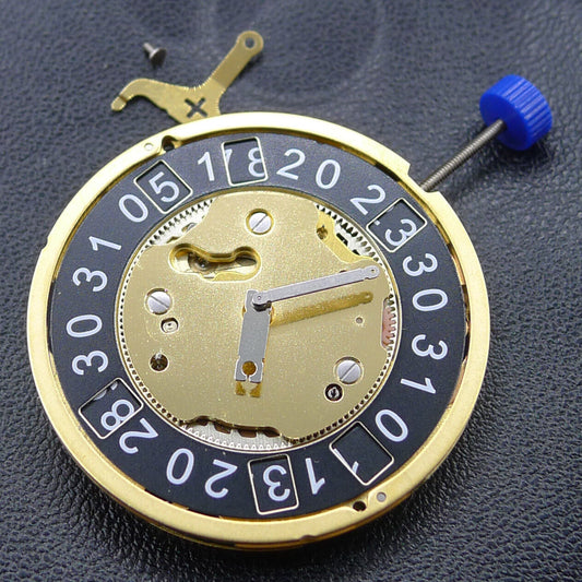 Ronda 5040B golden quartz watch movement with black disk, precision timepiece component.
