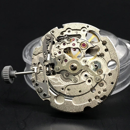 Silver and gold watch accessory featuring Miyota 82S0 mechanical movement by CITIZEN for precision timekeeping.