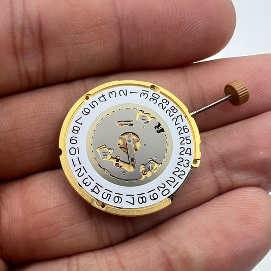 Ronda 6004D quartz watch movement with date display at 3 o'clock, precise timekeeping component