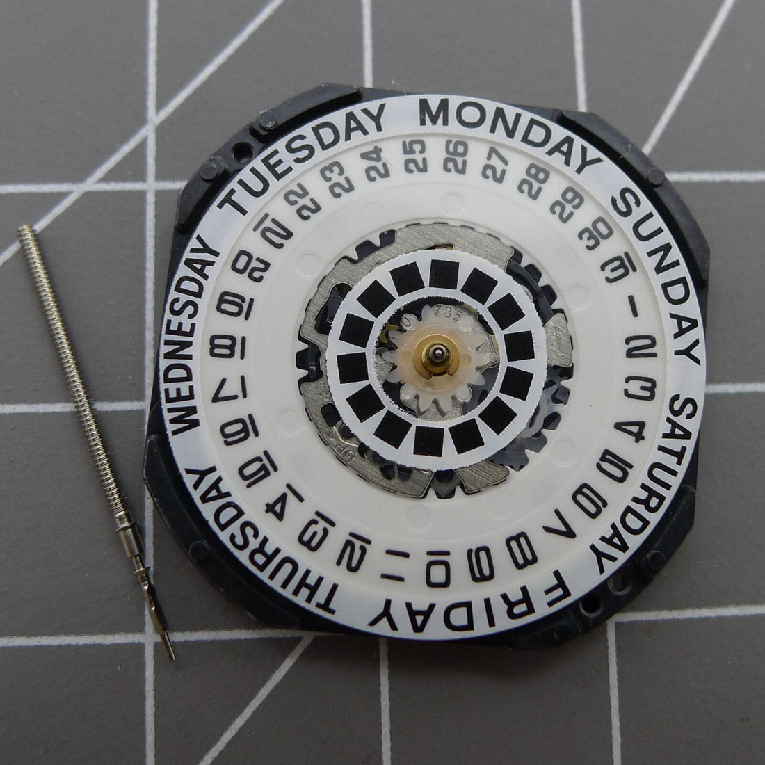 Japan Made Hattori Epson VX44E white dial quartz watch movement by TMI, precise timekeeping accessory.