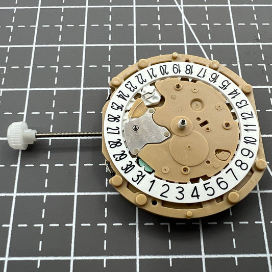 Sunon PE60 quartz watch movement with 3 hands and date display at 6 o'clock.