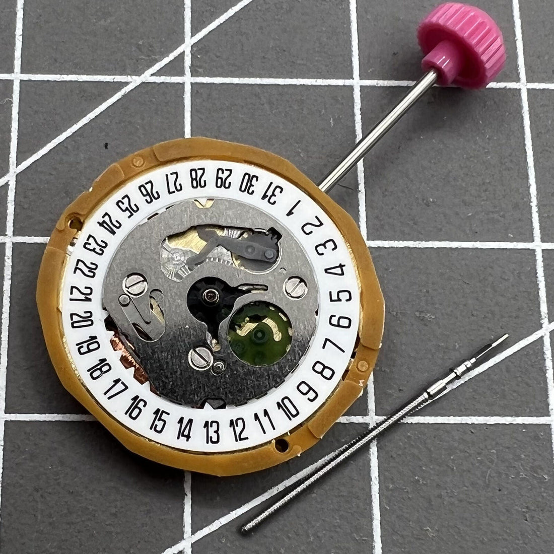 Miyota 9T13 Quartz Movement with date at 6 o'clock, precision Japanese watch component.