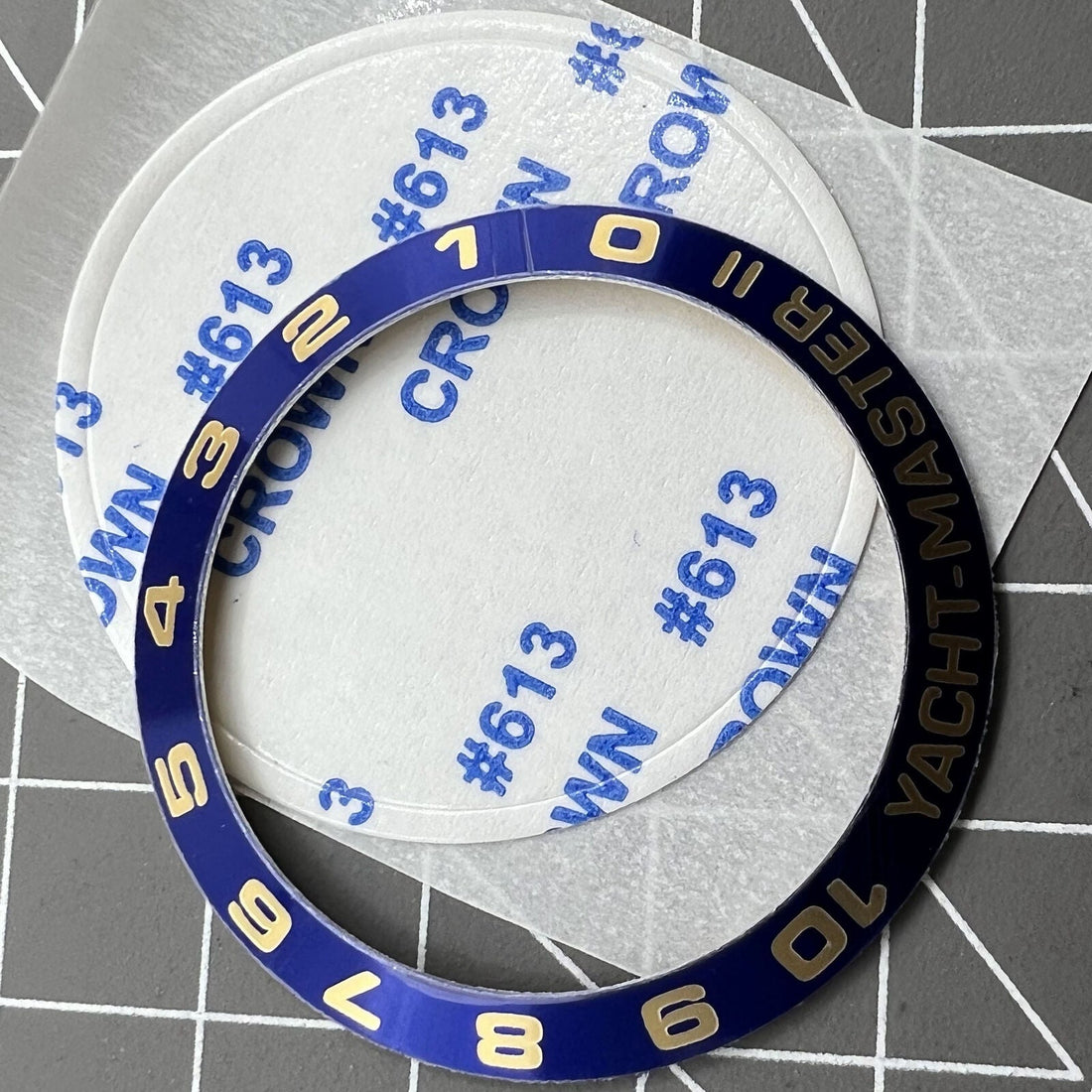 Golden and silver aluminium alloy watch bezel insert with numeral font for Yacht-Master 2 by Numerals.
