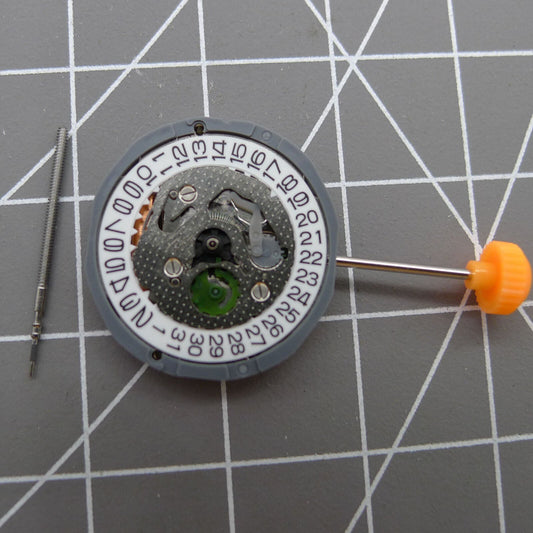 Miyota 1L12 Japan quartz watch movement with date display at 3 o?clock, precision timekeeping by Miyota.