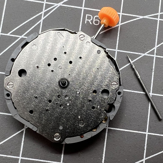 Japan Miyota JS10 quartz watch movement with small second hand at 6, 9, and 12 o'clock positions, precision made.