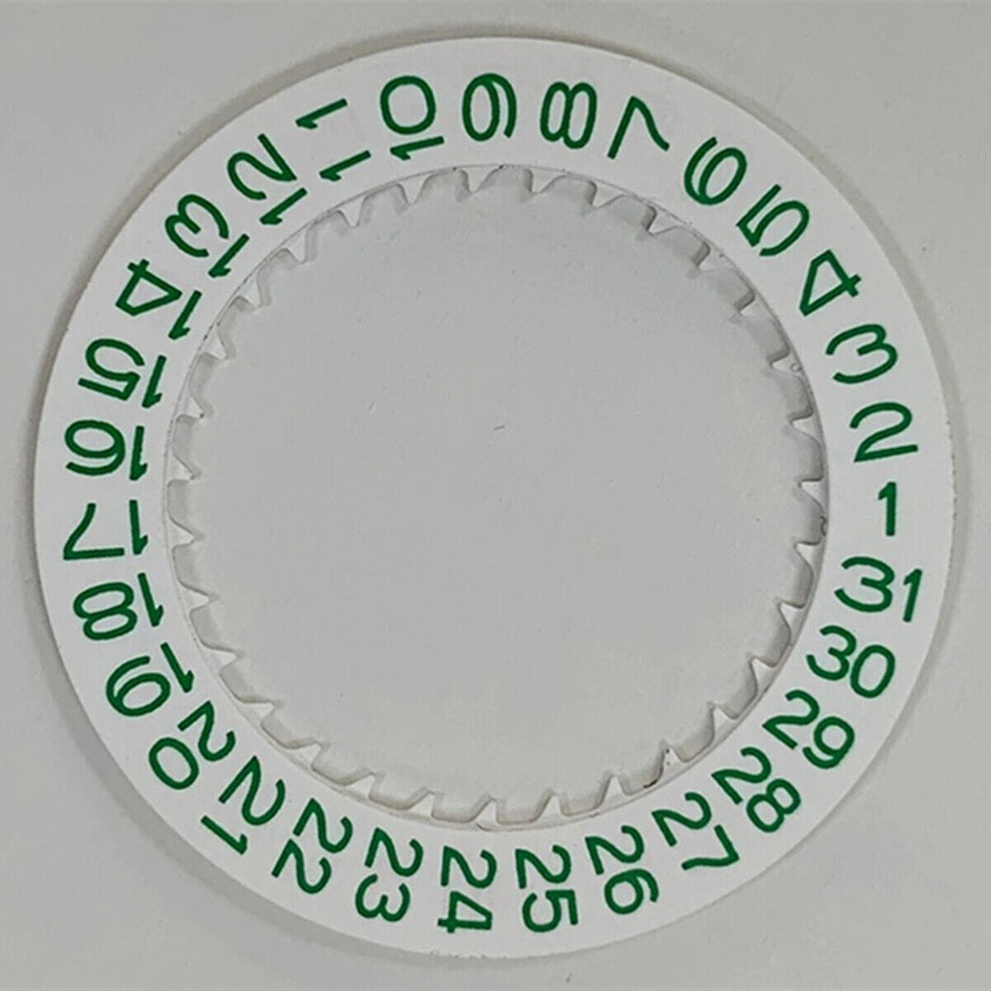 Green date disk wheel with white background for NH35 watch movement, enhancing date display accuracy.