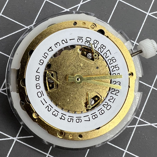 Swiss Made ETA251.272 quartz watch movement with date display at 4 o'clock, precise timekeeping accessory.