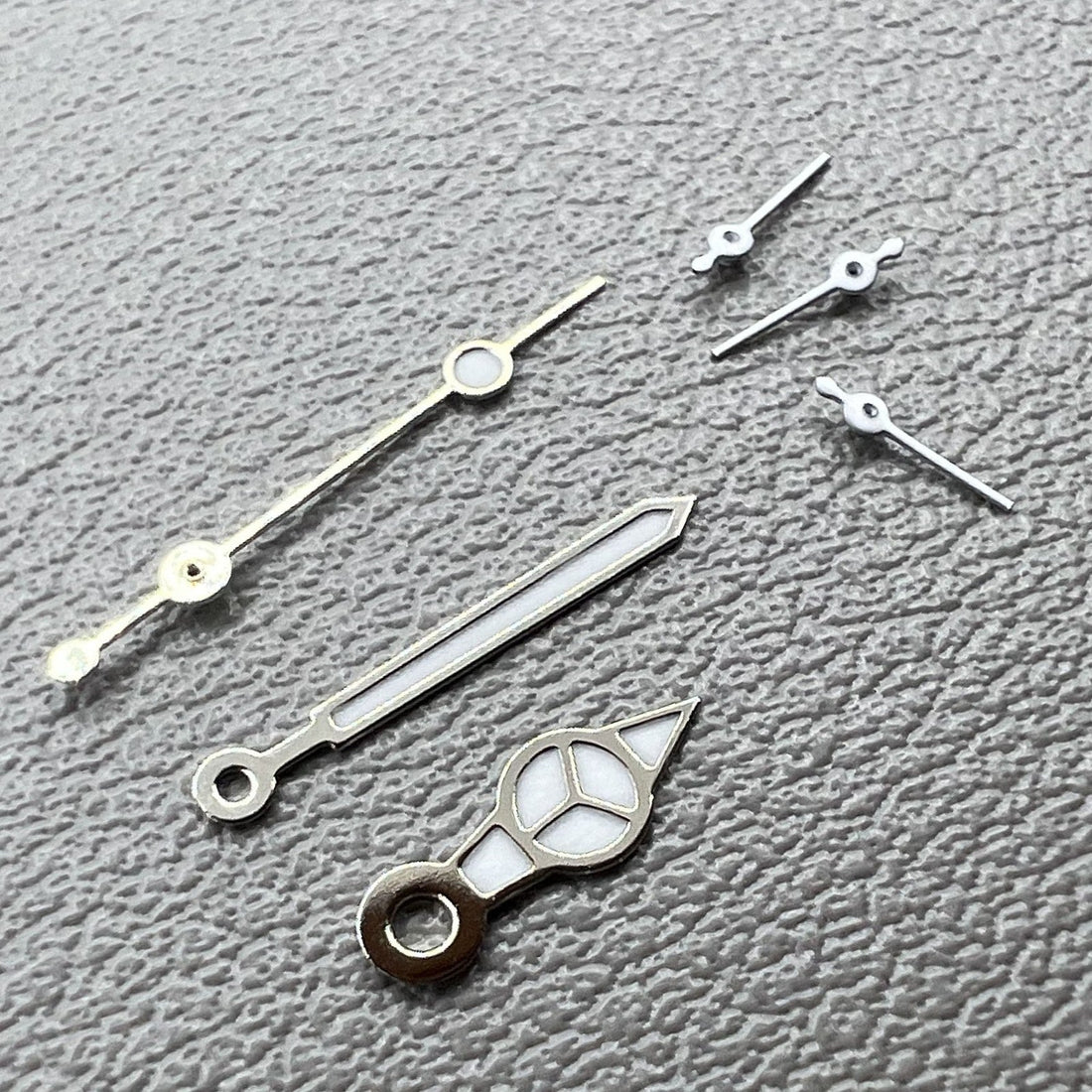 Set of 2 Weiss watch hands with silver edges, green luminous tips for VD53, VD54, VD57 movements by Weiss
