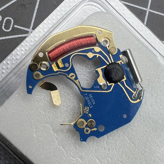 Circuit board with ETA 956.412 quartz movement components for Swiss-made watch repair.