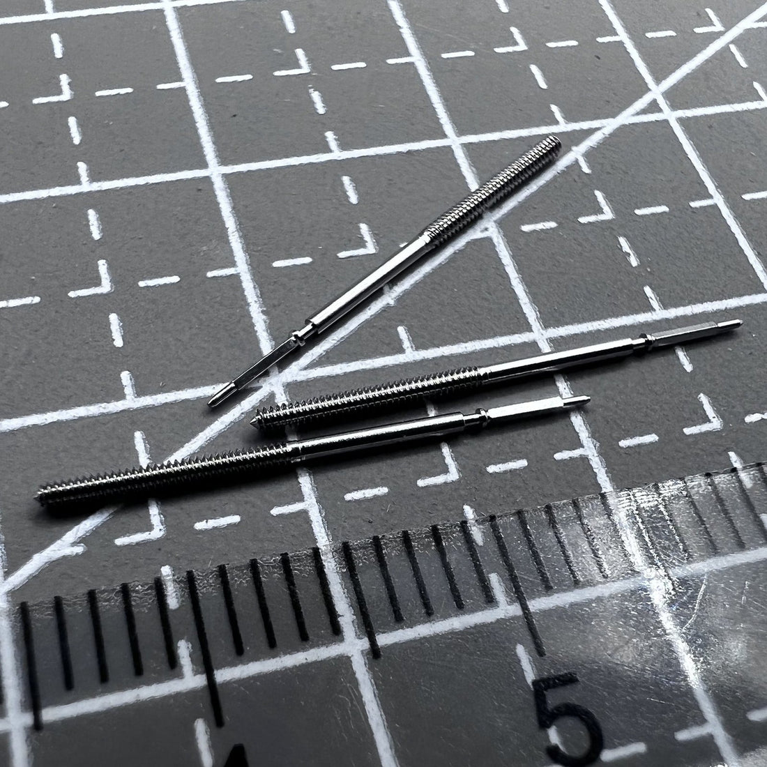 Set of 2 winding stems for ETA E64.111 watch movement, compatible replacement parts.