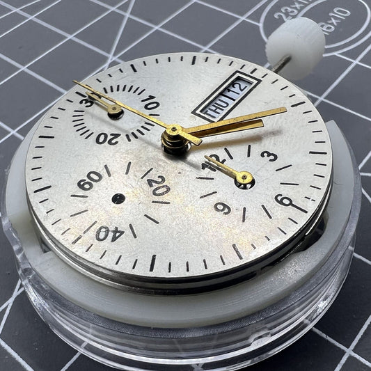 Close-up of China Made 7750 automatic chronograph movement with day-date at 3 o?clock, showcasing intricate ETA 7750 configuration.