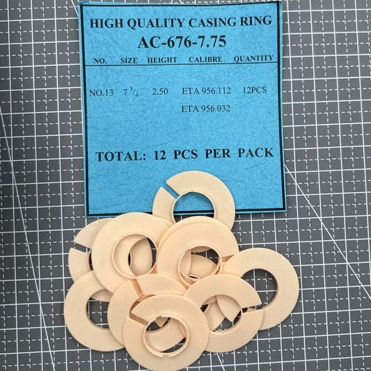 Set of 12 AC-676-7.75 watch casing rings and spacers for precise movement alignment in watch accessories.