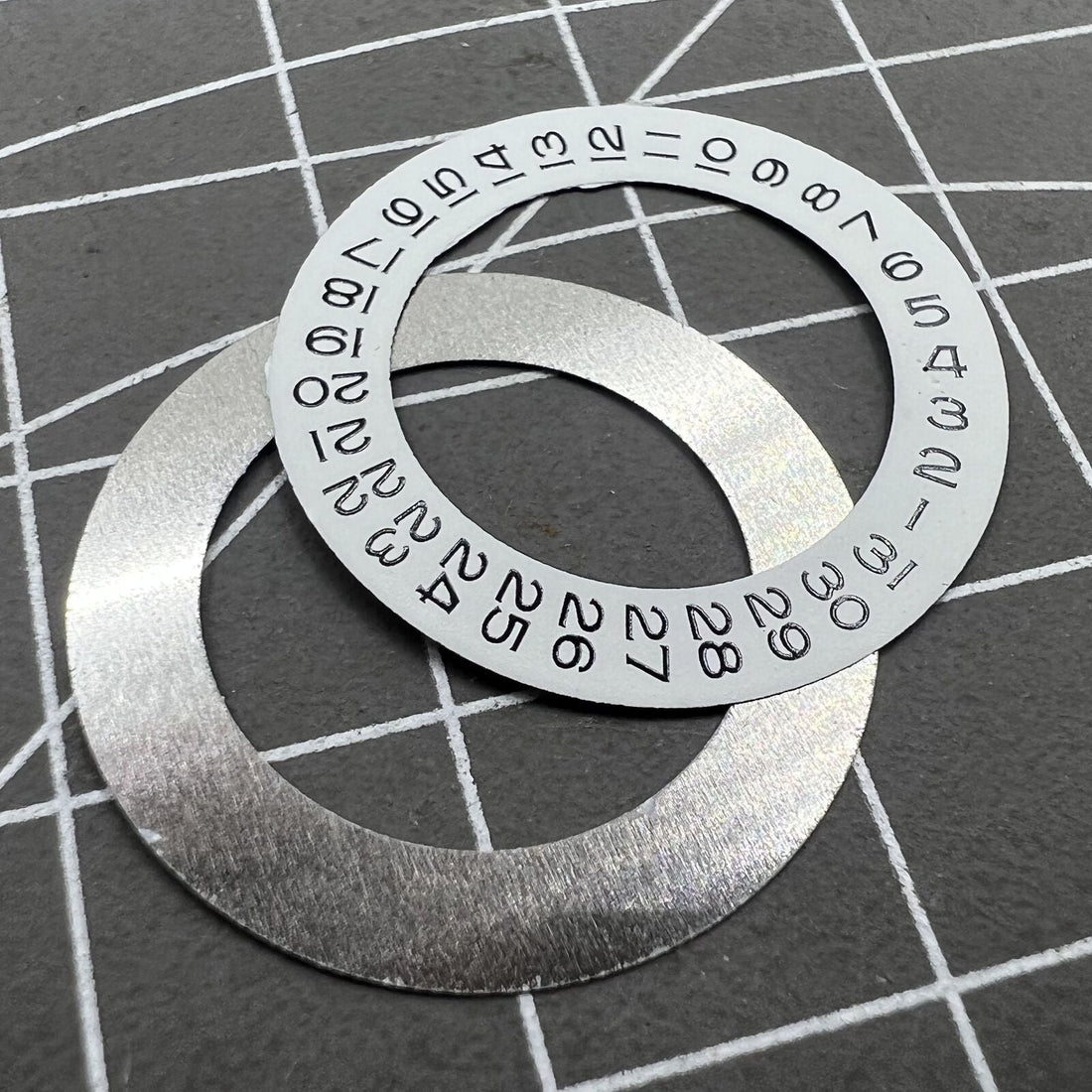 Date disk wheel overlay for Tianjin Seagull 2824 watch movement, precise fit and durable design.