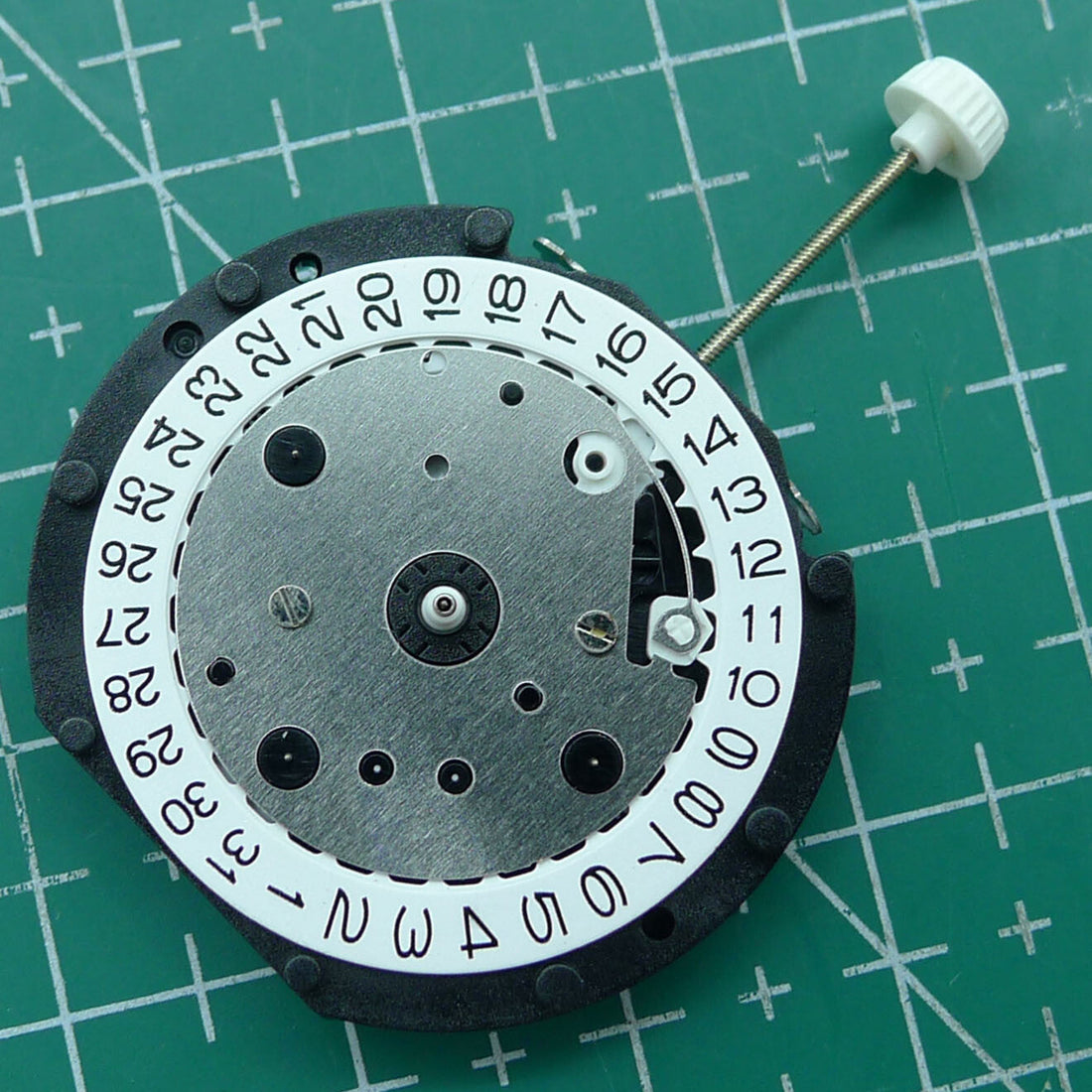LD57 quartz movement watch repair part with small second hand at 6 o?clock, precision replacement component.